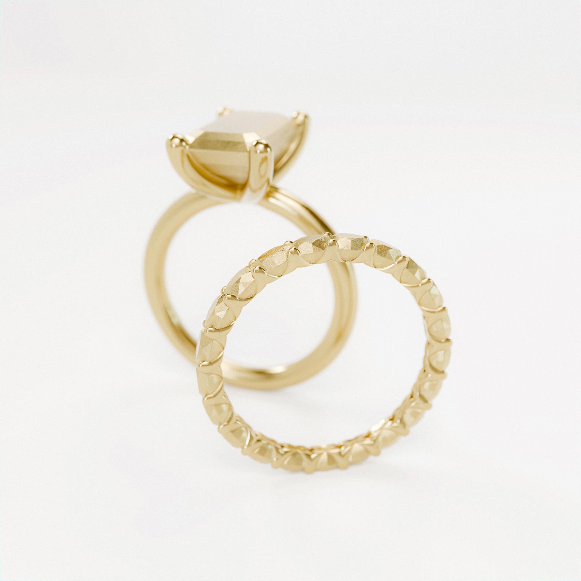Arrangement of handmade gold memoire and emerald rings from the lost collection by offfhand. Designed by michael rüscher.
