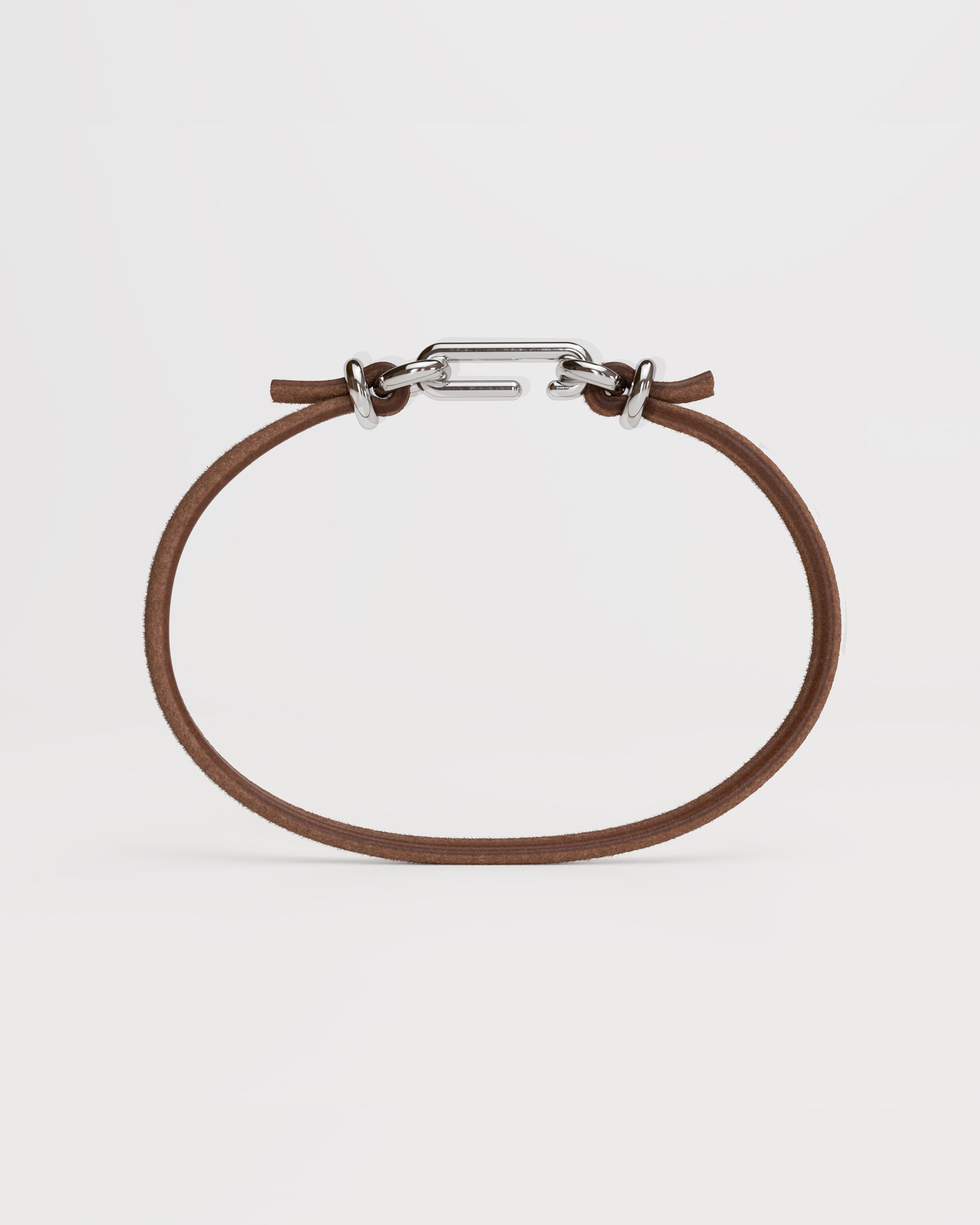 Packshot of the handmade bracelet with leather light band and silver clasp, from the BOND collection by OFFFHAND. Designed by Michael Rüscher.