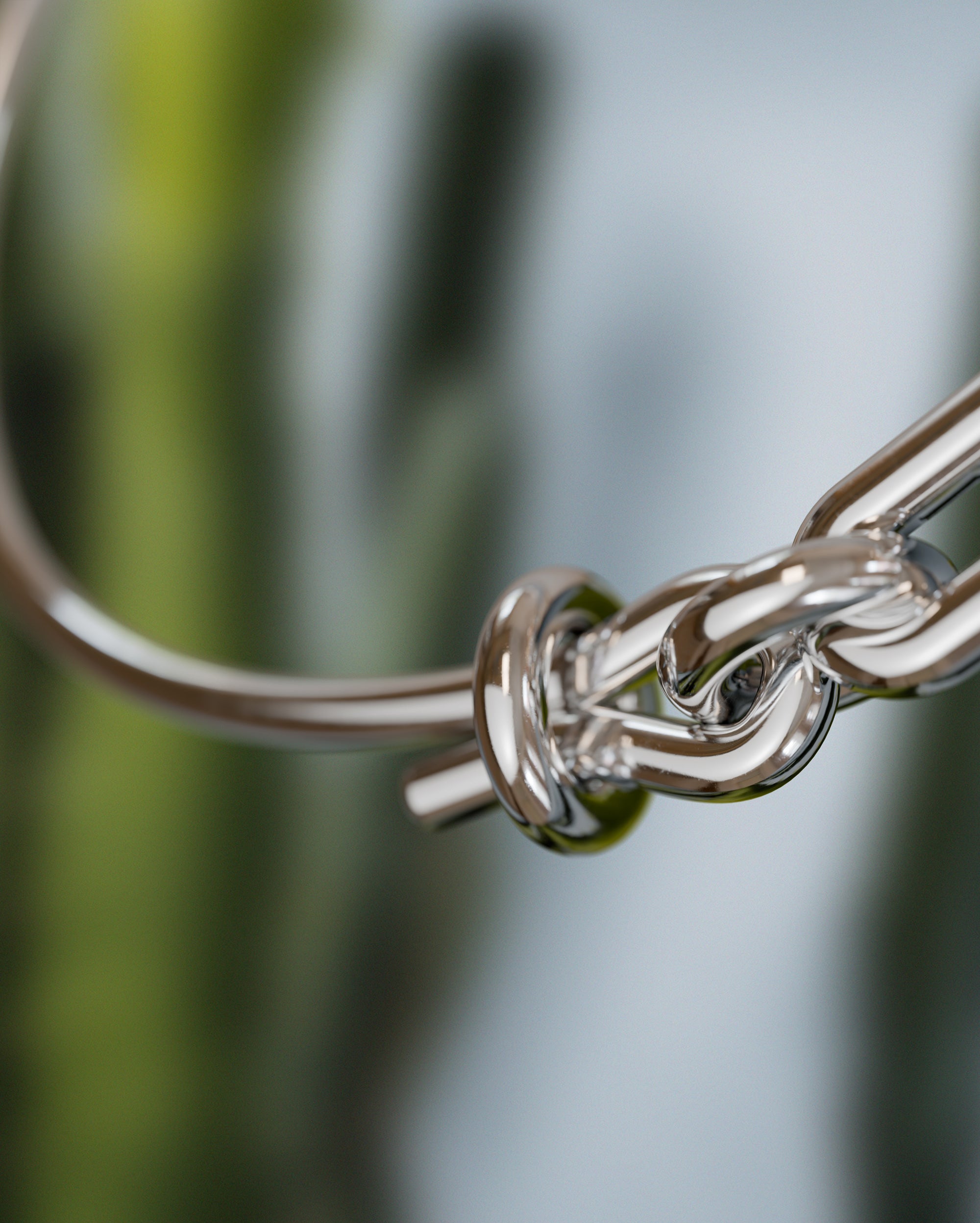 Detail of the handmade bracelet with silver band and silver clasp, from the BOND collection by OFFFHAND. Designed by Michael Rüscher.