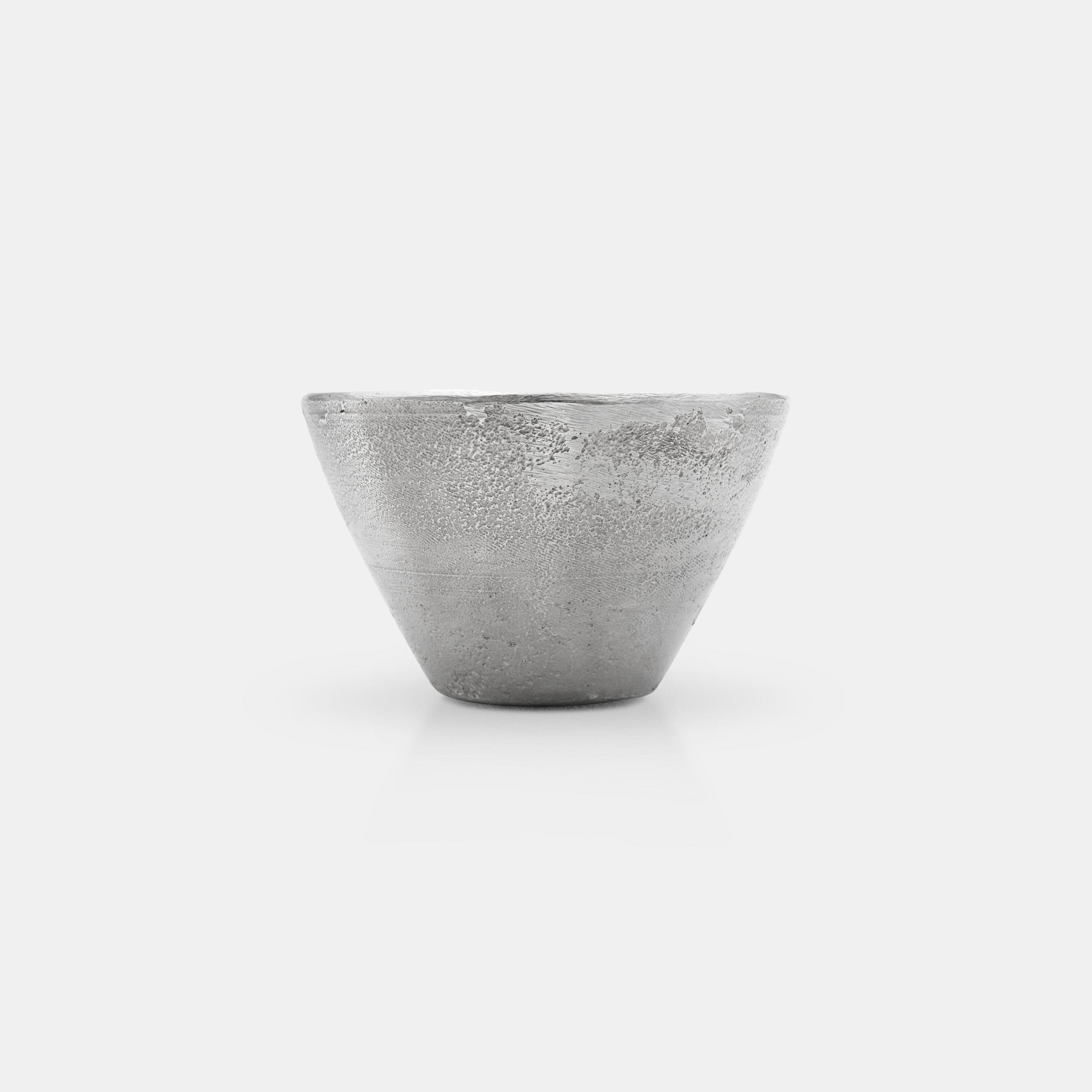 Front view of the OFFFHAND HOLD Cup made from pure silver in a studio setting.