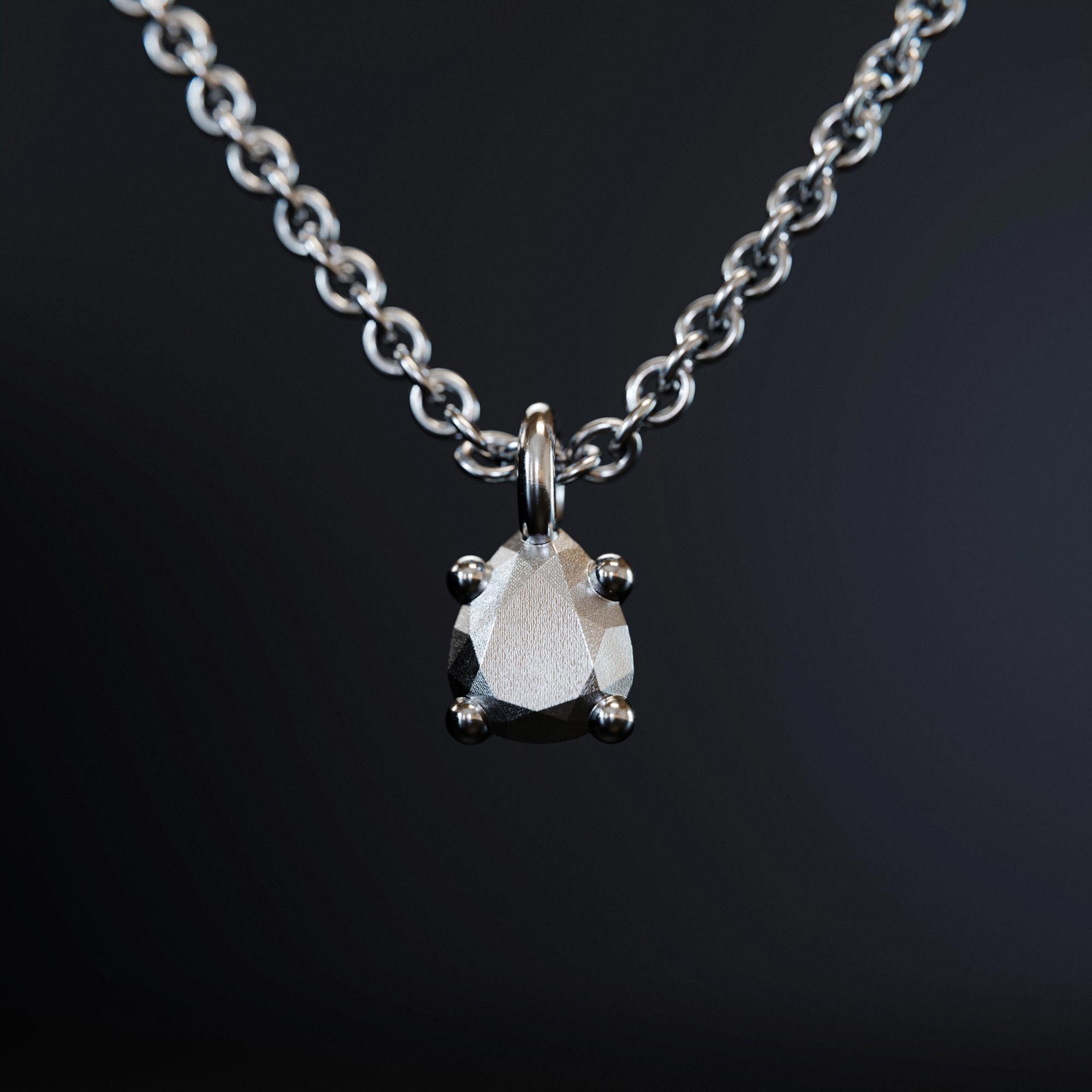 Handmade small platinum pear charm from the LOST collection by OFFFHAND. Designed by Michael Rüscher.