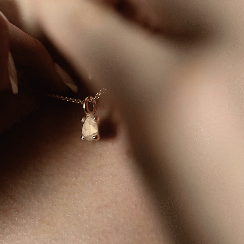 Handmade small pear gold charm from the Lost collection by OFFFHAND. Designed by Michael Rüscher.