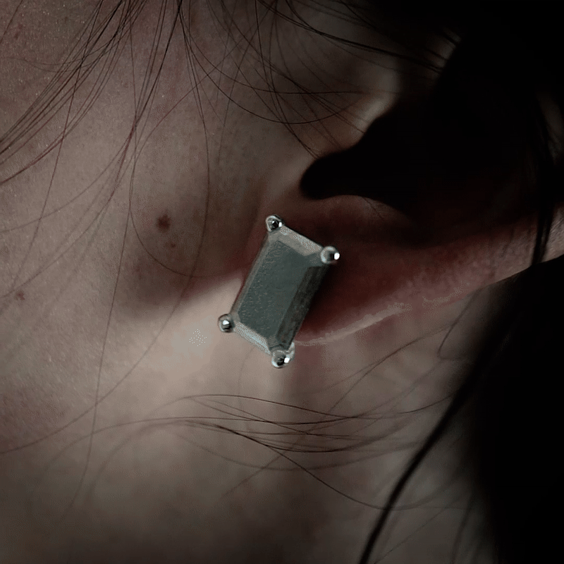 Handmade large platinum emerald earring from the LOST collection by OFFFHAND. Designed by Michael Rüscher.