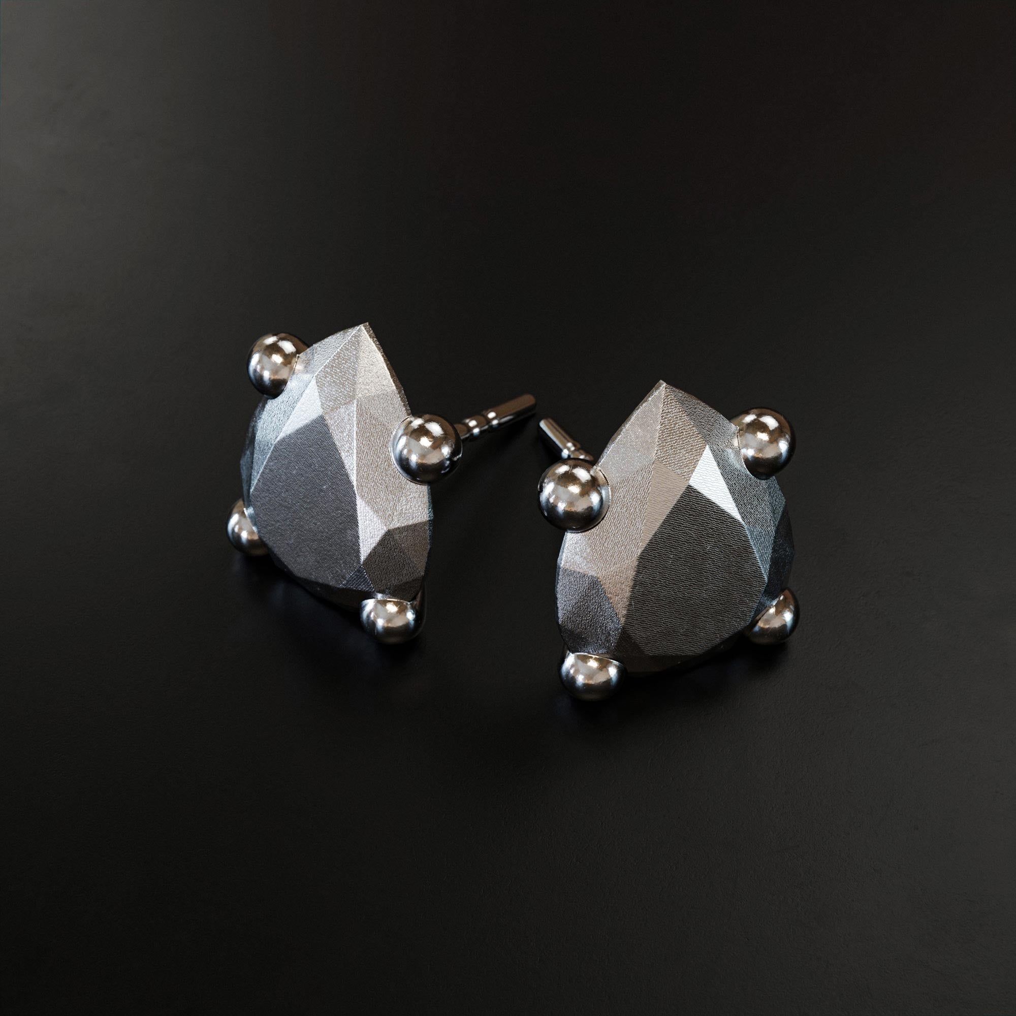 Handmade large platinum pear earring from the LOST collection by OFFFHAND. Designed by Michael Rüscher.