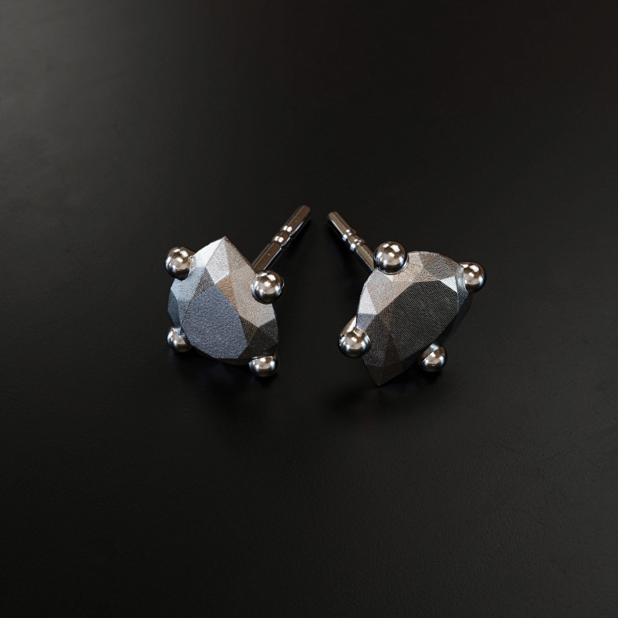 Handmade small platinum pear earring from the LOST collection by OFFFHAND. Designed by Michael Rüscher.