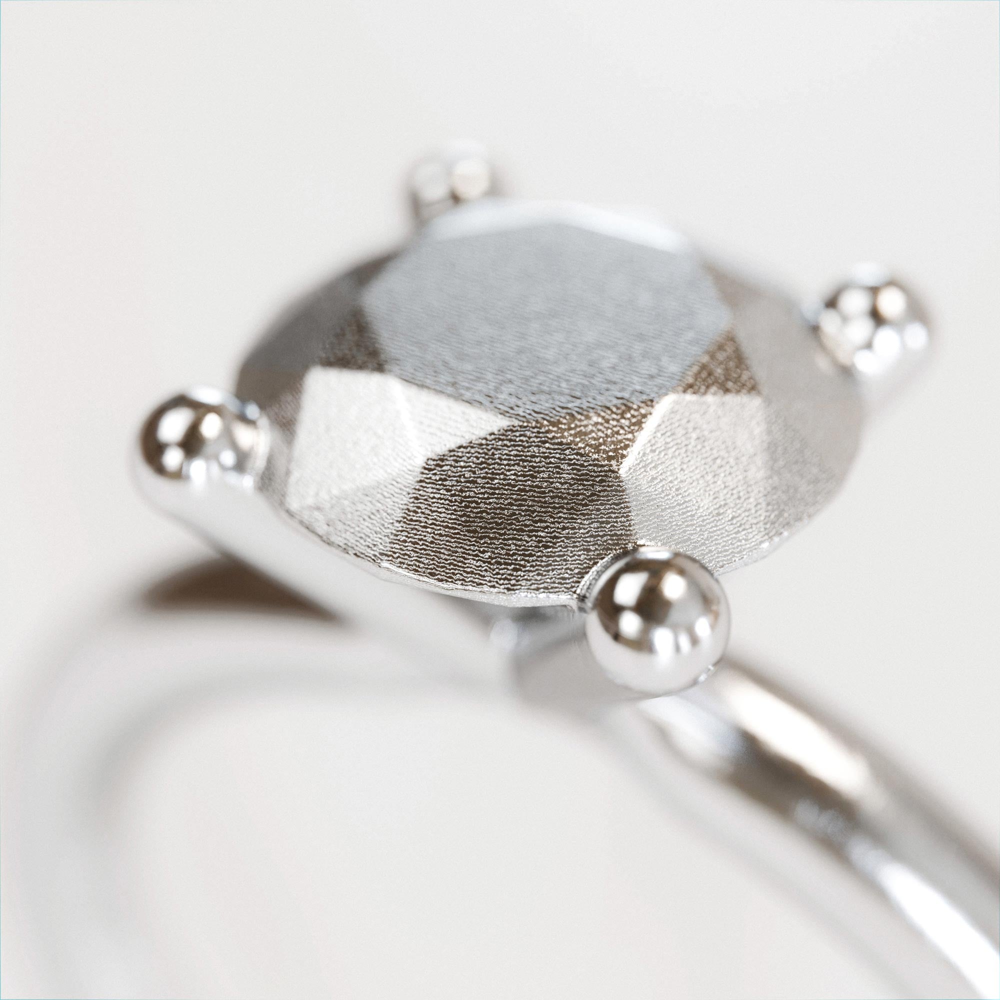 Detail view of the handmade small silver brilliant ring from the LOST collection by OFFFHAND. Designed by Michael Rüscher.