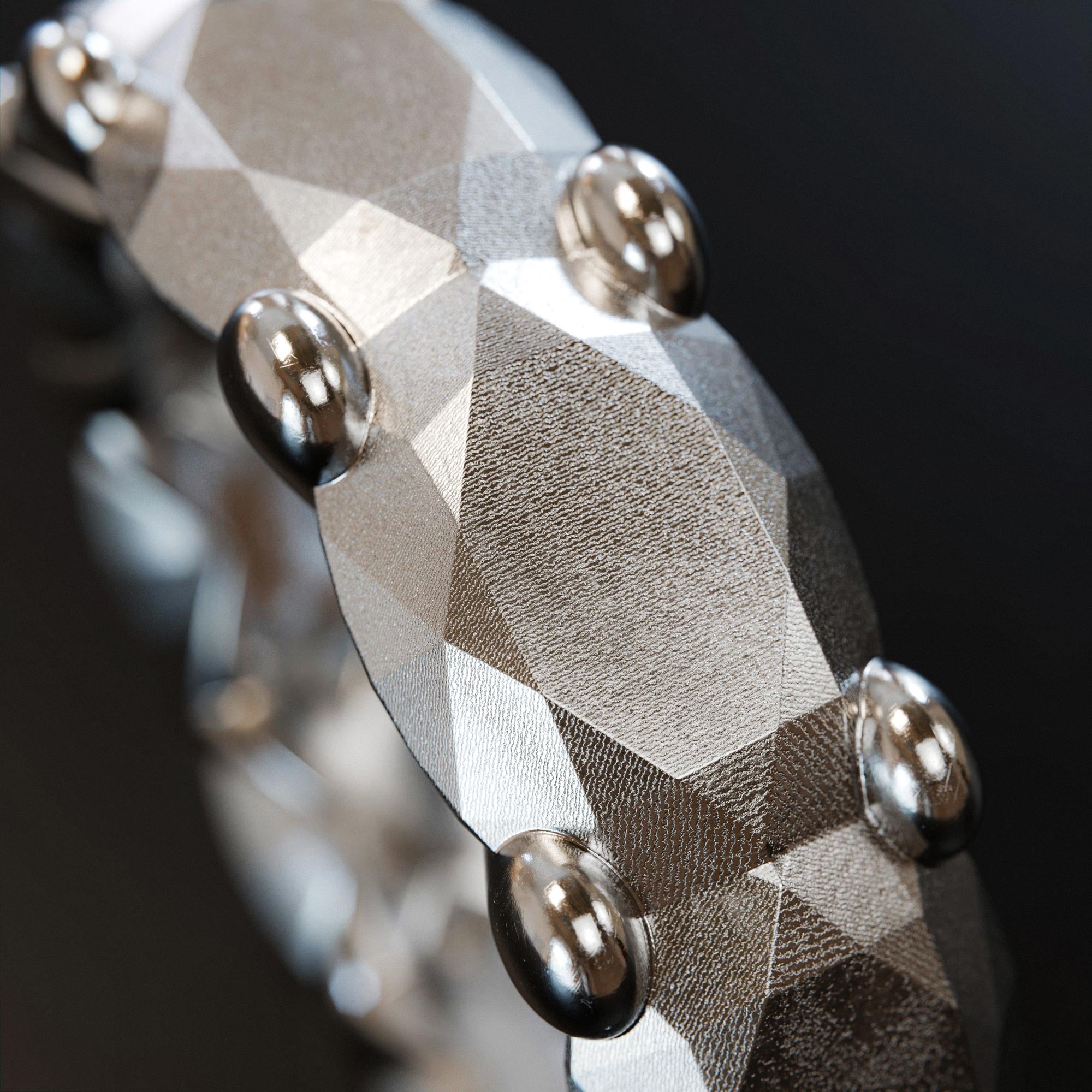 Detail view of the handmade large platinum memoire ring from the LOST collection by OFFFHAND. Designed by Michael Rüscher.