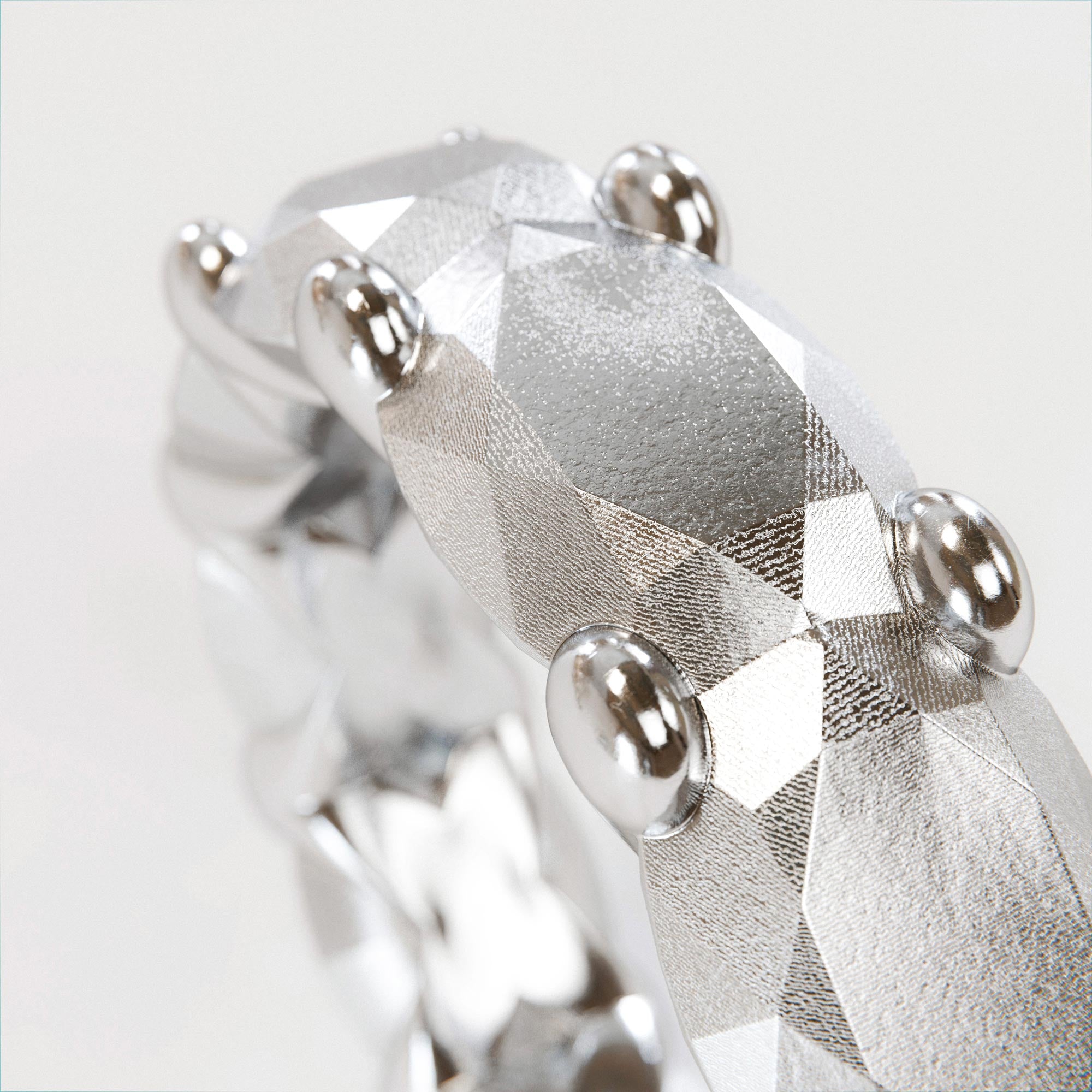 Detail view of the handmade large silver memoire ring from the LOST collection by OFFFHAND. Designed by Michael Rüscher.