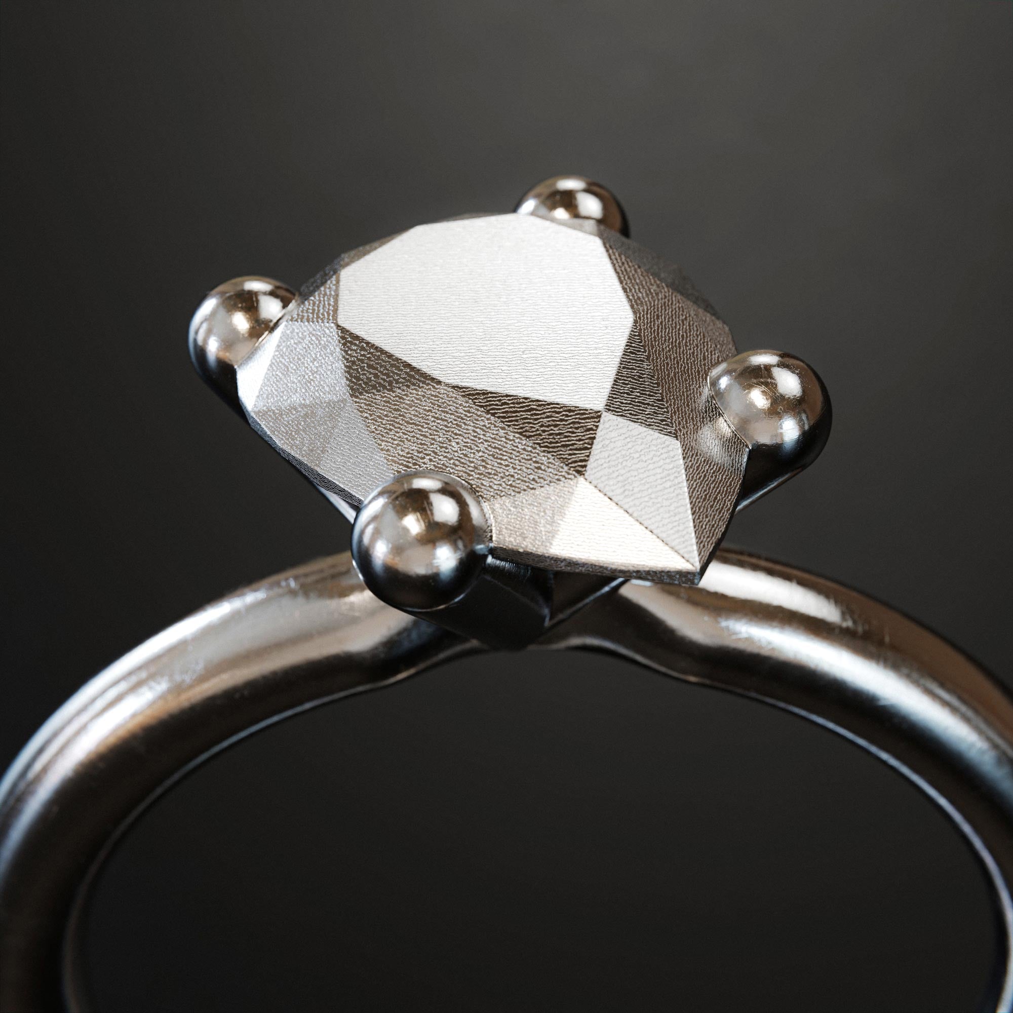 Detail view of the handmade large platinum pear ring from the LOST collection by OFFFHAND. Designed by Michael Rüscher.