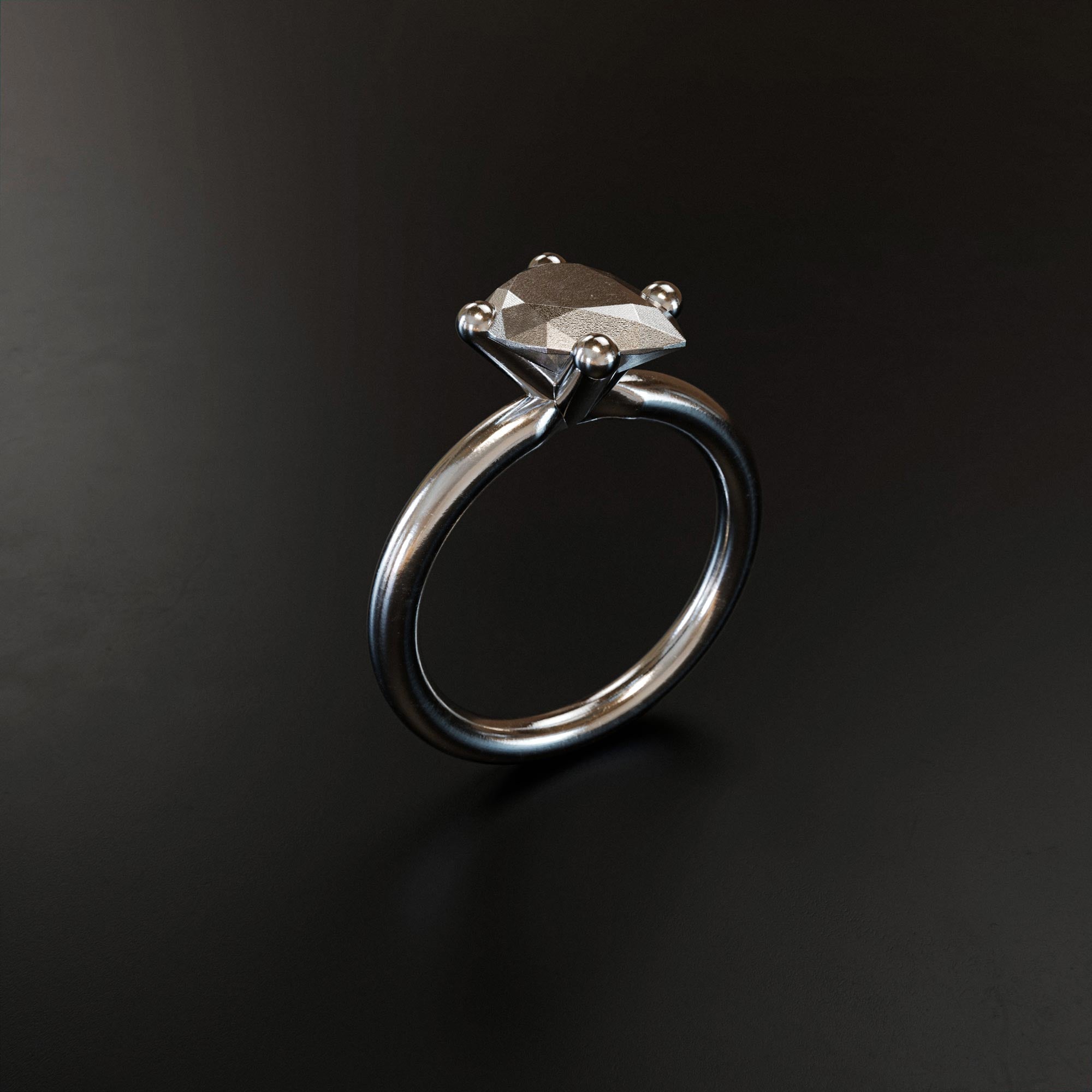 Handmade small platinum pear ring from the LOST collection by OFFFHAND. Designed by Michael Rüscher.