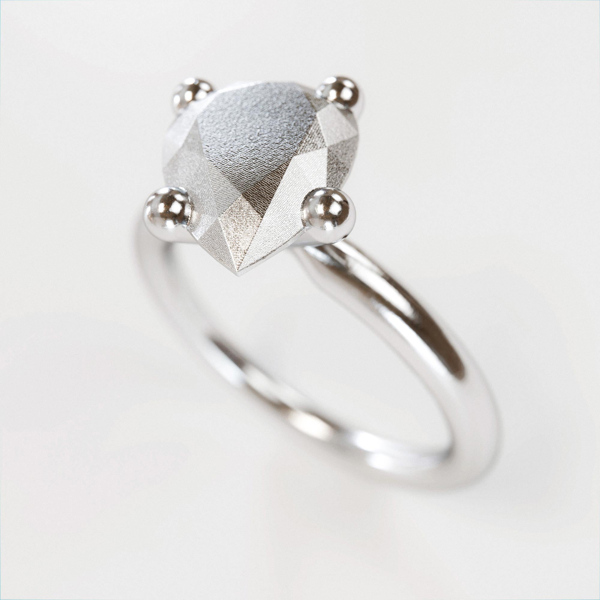 Detail view of the handmade large silver pear ring from the LOST collection by OFFFHAND. Designed by Michael Rüscher.