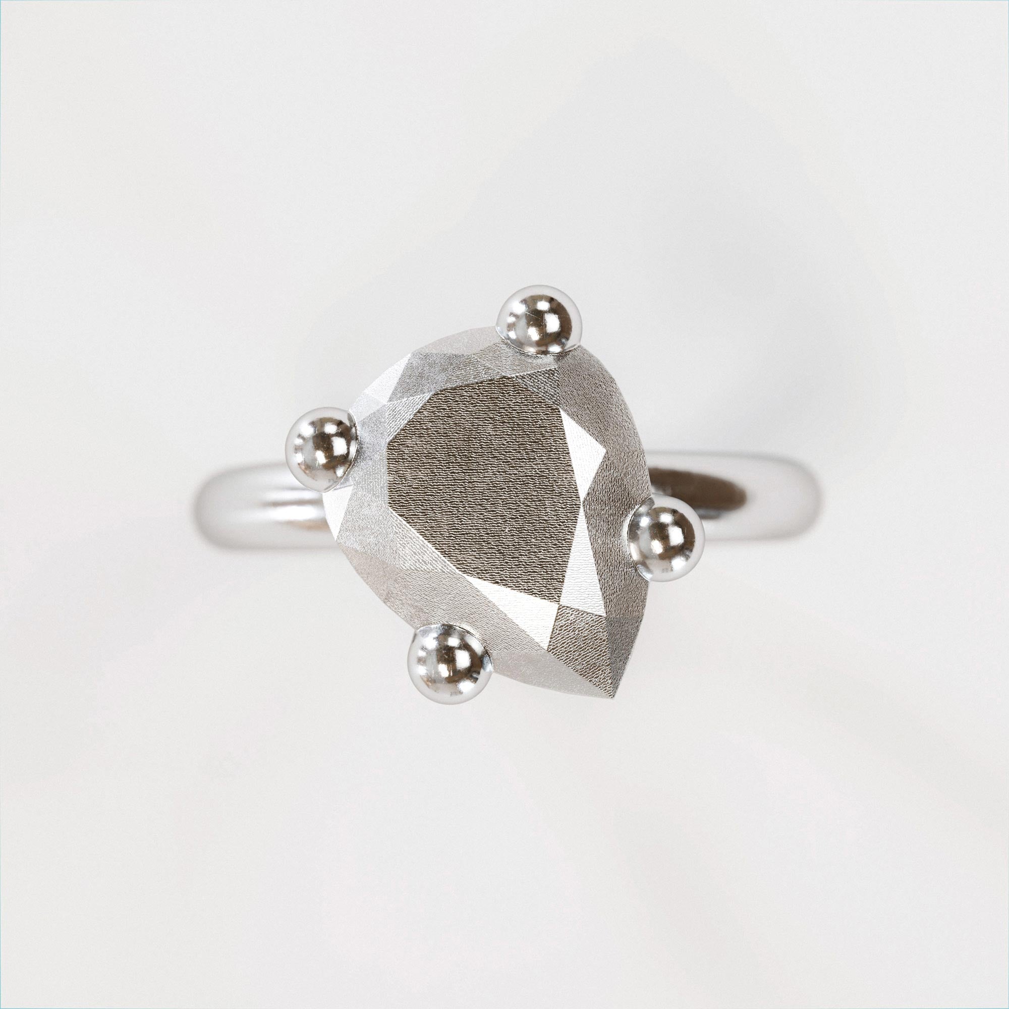 Detail view of the handmade small silver pear ring from the LOST collection by OFFFHAND. Designed by Michael Rüscher.