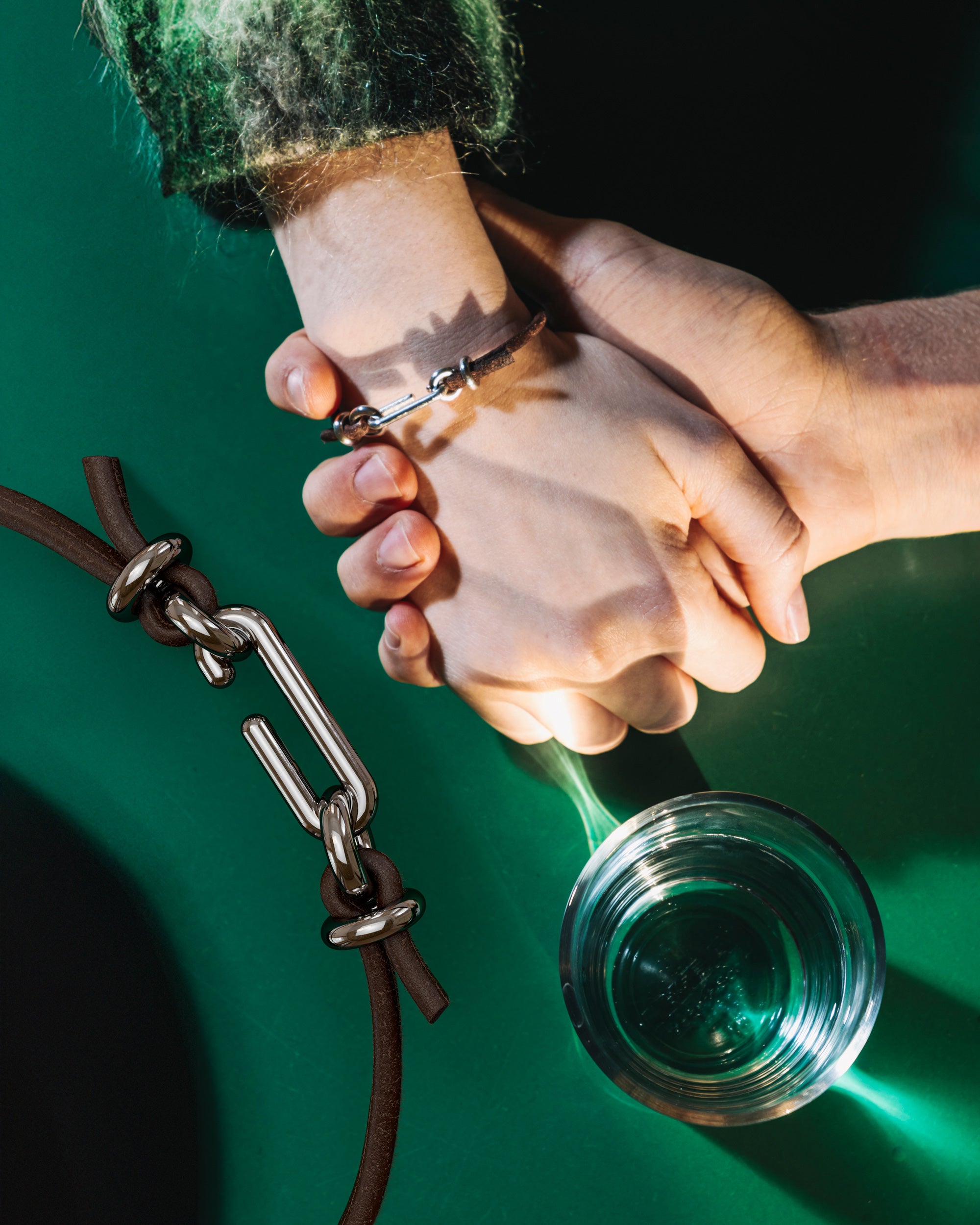Collage of the handmade bracelet with leather dark band and platinum clasp, from the BOND collection by OFFFHAND. Designed by Michael Rüscher.