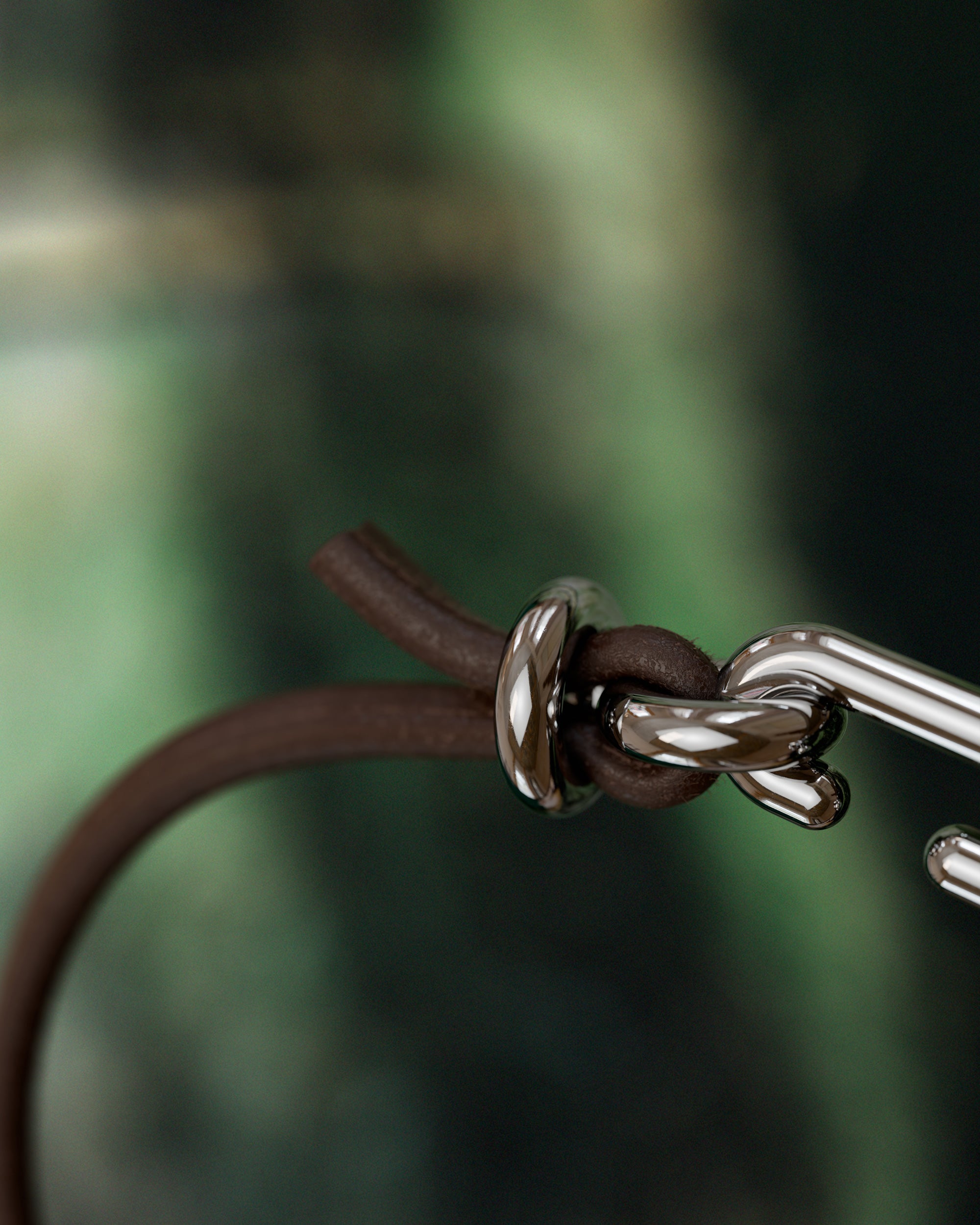 Detail of the handmade bracelet with leather dark band and platinum clasp, from the BOND collection by OFFFHAND. Designed by Michael Rüscher.